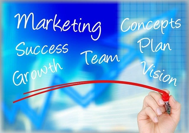 A hand writing digital marketing concepts on a chalkboard. A hand writing digital marketing concepts on a chalkboard.