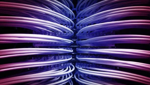 A close up of blue wires in a data center.