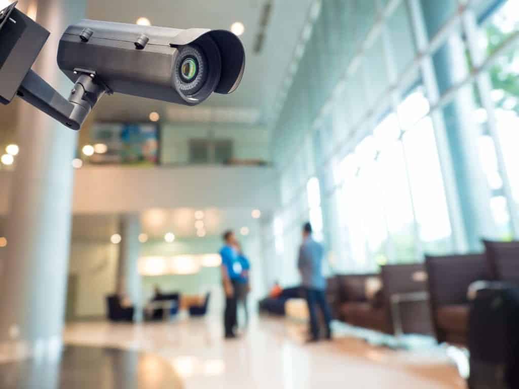 Office building lobby surveillance with CCTV camera.