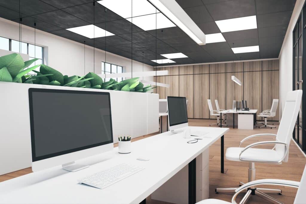 Contemporary office interior with empty computer and coffee cup on desk. Mock up, 3D Rendering