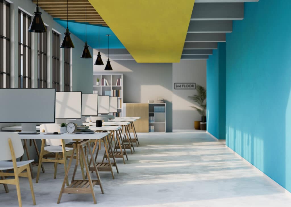 An office with blue and yellow walls providing computer help and phone services.